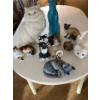 Image 1 :  collection of various ceramic cat figurines.The figurines include a large whi