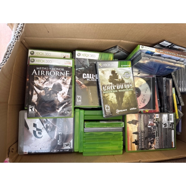 Full box of Xbox games and some CD's mixed in
