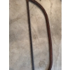 Image 3 : Steel bow saw featuring a curved frame and toothed blade, suitable for cutting wood. The frame displ