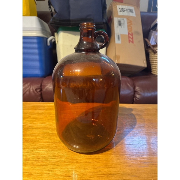  vintage one-gallon amber brown glass handled jug, often utilized for homebrewing or collected for i