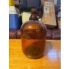 Image 1 :  vintage one-gallon amber brown glass handled jug, often utilized for homebrewing or collected for i