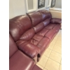 Image 3 : burgundy leather reclining sofa features a center console with built-in cup holders. 