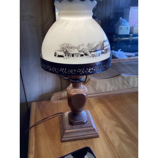 This is a vintage Currier & Ives milk glass hurricane electric lamp featuring a black and white farm