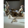 Image 1 : collection of various figurines, including a prominent brass or bronze dragon, a clear quartz or gla