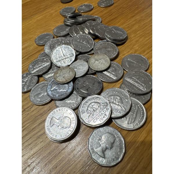 PILE OF NICKLES AND SOME SILVER DIMES