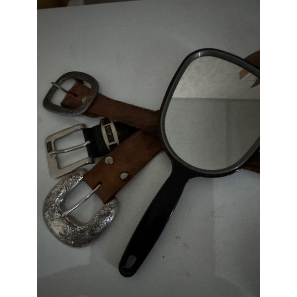 Leather belts and hand mirror.