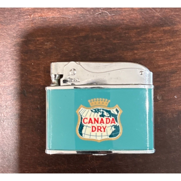  vintage Canada Dry Penguin advertising lighter, manufactured in Japan during the 1950s or 1960s. 
D