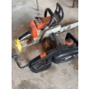 Image 5 : Stihl 024 AV gas chainsaw and a Remington 3.0 electric chainsaw with a 16-inch bar. Both chainsaws a