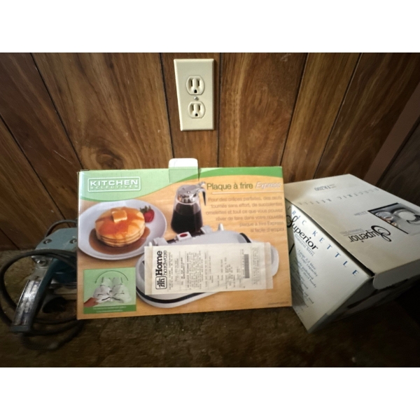 kitchen selectives, pancake maker, and electric kettle box full of Christmas lights and antique meta