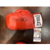 Image 1 : James Buster Douglas signed Everlast boxing glove. 
It features a black ink signature on a red glove