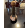 Image 6 : Decorative decanter featuring a ship illustration on the . The neck is wrapped in a dark material, 
