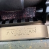 Image 17 : Ruger American bolt-action rifle chambered in 7mm-08 Rem. Features a green speckled synthetic stock,