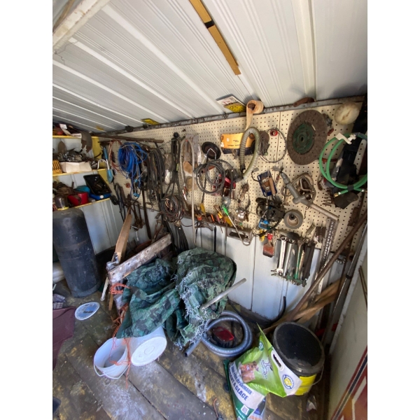 Shed contents all contents on right side of wall back shelving all contents, and left side of shed a
