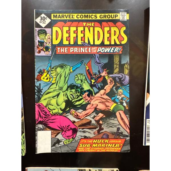 vintage comic book titled The Defenders #52, published by Marvel Comics Group. 
Title: The Defenders
