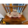 Image 2 : vintage Victorian-style washbasin and pitcher set decorated with a pink transferware floral pattern.