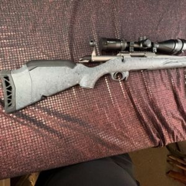 Ruger American bolt action rifle chambered in .243 Win, matte grey speckled synthetic stock, fluted 