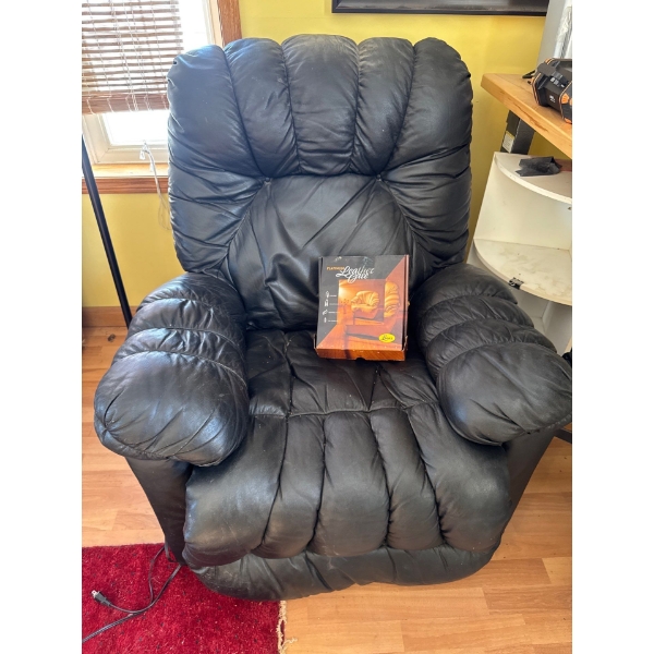  black leather recliner chair,  featuring an overstuffed design for added comfort. .leather care kit