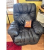 Image 1 :  black leather recliner chair,  featuring an overstuffed design for added comfort. .leather care kit