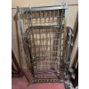 Image 3 : Vintage baby crib with a metal frame and spring mattress support. The crib is designed with a classi