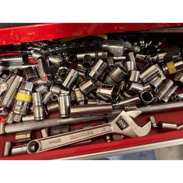 A miscellaneous collection of chrome sockets, extensions, and a 200mm adjustable wrench, likely for 