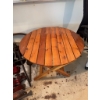 Image 4 : Round folding table made of wood, measuring approximately 32 inches in diameter and 28 inches in hei