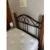 Image 2 :  twin-sized mattress and box spring set with a classic black metal and wood bed frame.