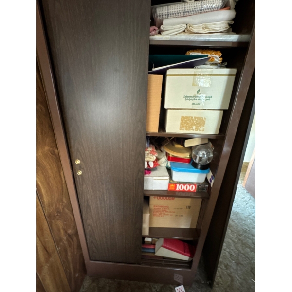 Filing cabinet full of boxes, puzzles, globes, unknown items, linen, books, metal filing cabinet. 30
