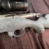 Image 11 : Ruger American bolt action rifle chambered in .243 Win, matte grey speckled synthetic stock, fluted 
