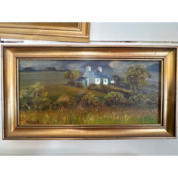 framed oil painting depicts a pastoral landscape featuring a small, white cottage with a blue roof 