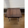 Image 1 : vintage side table featuring a traditional American dough box on a wrought iron stand.