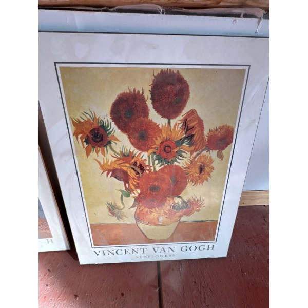 A framed art print reproduction of the famous "Sunflowers" painting series by Vincent van Gogh. A va