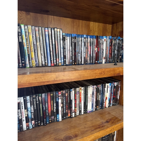 Two shelves of Blu-Ray and DVDs