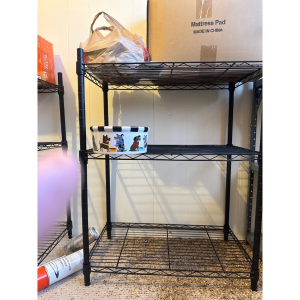 Black metal shelving unit, 23in wide, 13in deep and 28in tall.