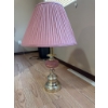 Image 1 : Table lamp featuring a brass base and column with a round pink glass accent, topped by a pleated pin