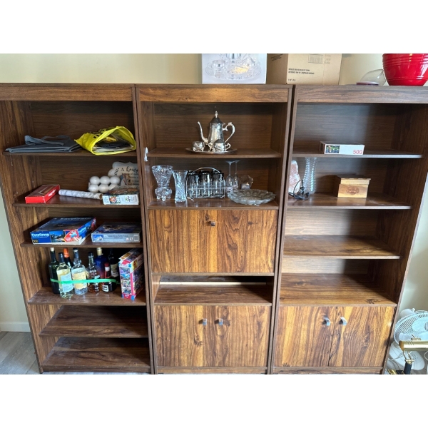 Three separate hutches with all contents except the alcohol included. It includes one vintage silver
