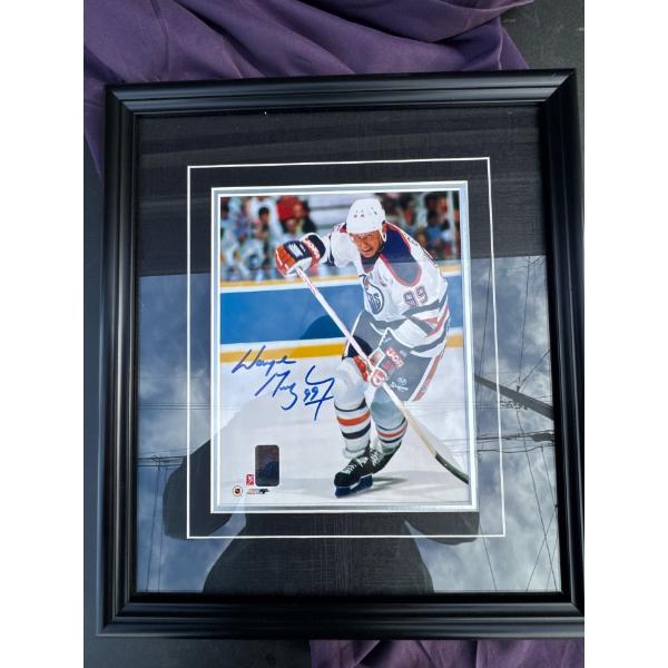Signed Wayne Gretzky photo framed. 15 and a quarter wide by 17 and a quarter long With certificate o