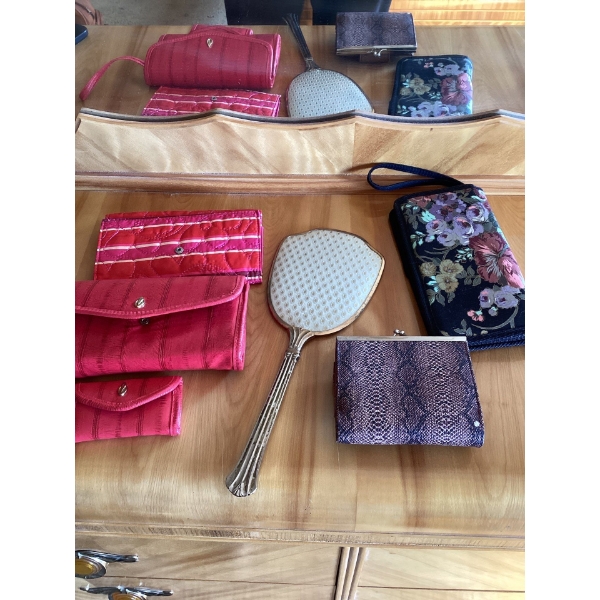 Small brown and purple snakeskin print wallet with a clasp closure.Vintage hand mirror, likely part 