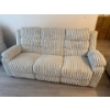Image 1 :  contemporary-style sofa,  featuring a light-colored ribbed corduroy fabric. reclining