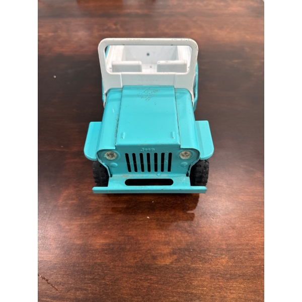 vintage 1960s Tonka Jeep Dispatcher toy, specifically the turquoise and white pressed steel model pr