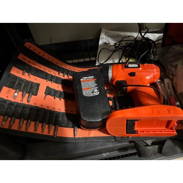 black and decker with battery, charger, and battery and carrying case.
