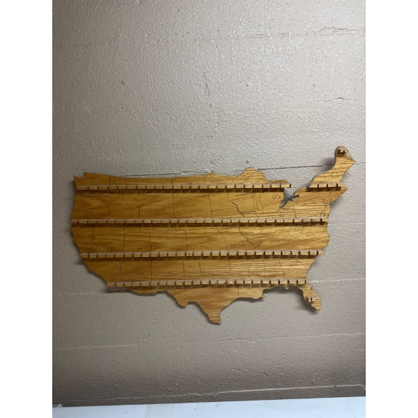  wooden USA map display rack designed to hold collectibles such as souvenir spoons or wine corks. 