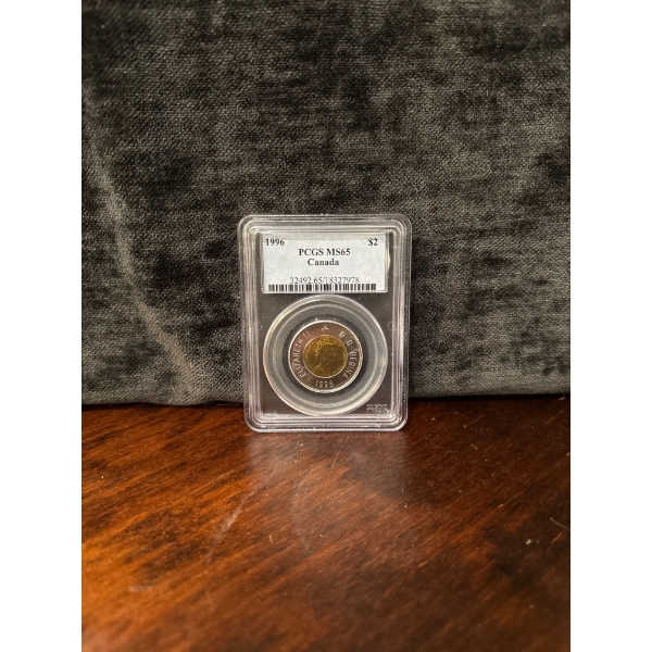  1996 Canada $2 "Toonie" coin, graded MS65 (Mint State 65) by the Professional Coin Grading Service 
