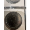 Image 24 : Canadian coins, featuring commemorative dollar coins and 50 cent pieces. Notable coins include a 197
