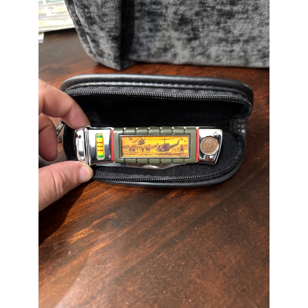  Franklin Mint collector's knife featuring a "Vietnam UH-1B Huey" helicopter design on the handle an