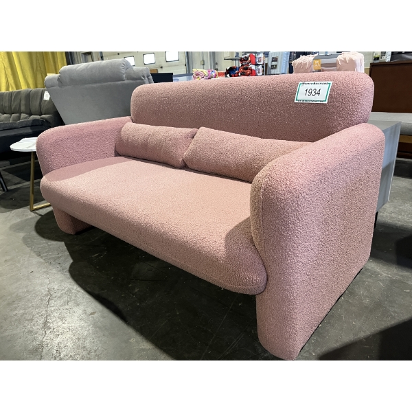 Fluffy Pink Sofa with Accented Back