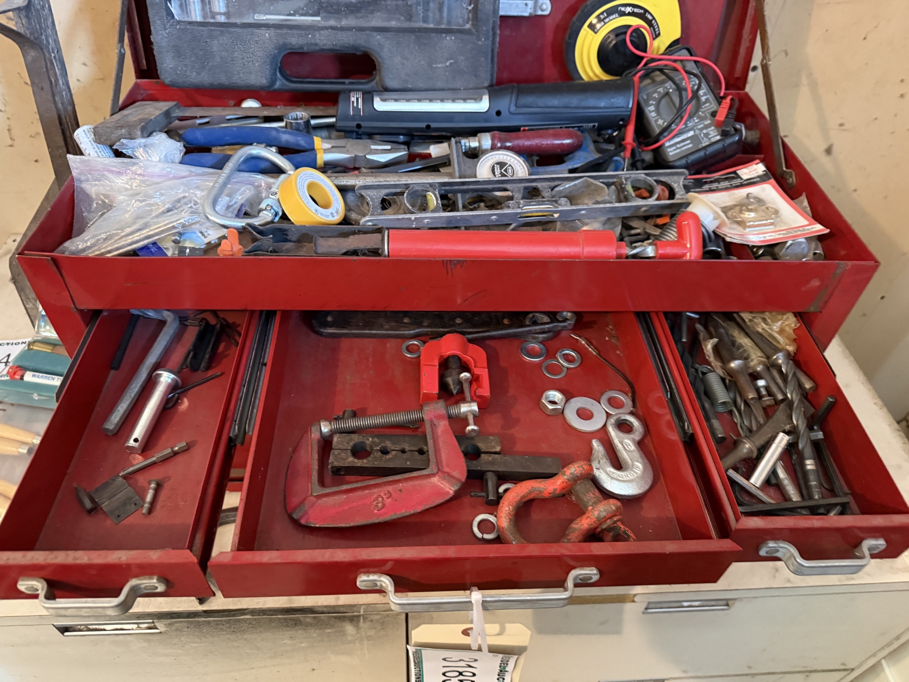 red tool box with assorted tools