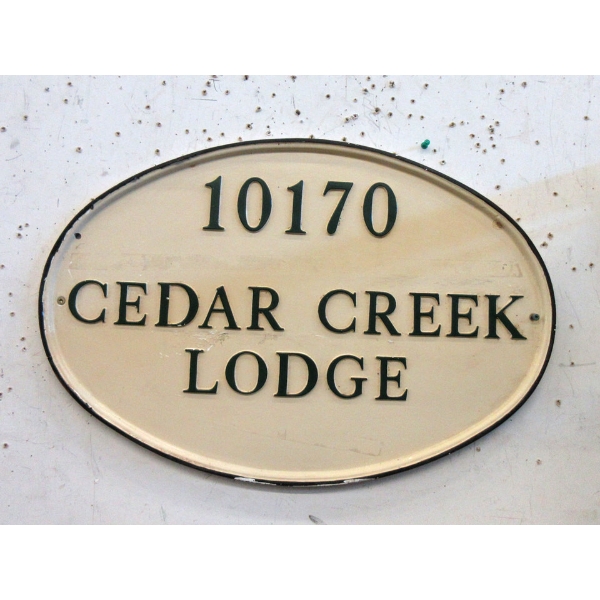 Porcelain "10170 Cedar Creek Lodge" Sign