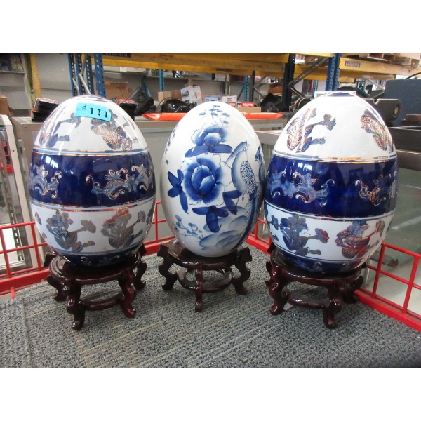 3 Large Glazed Porcelain Eggs on Stands
