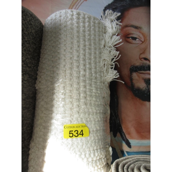 6.5' x 9' Ivory Textured Area Carpet with Tassels