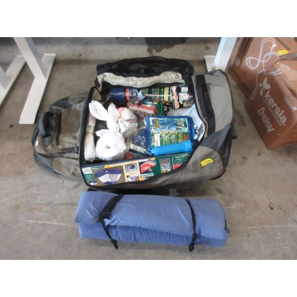 Duffle Bag Full of Camping Goods and Accessories